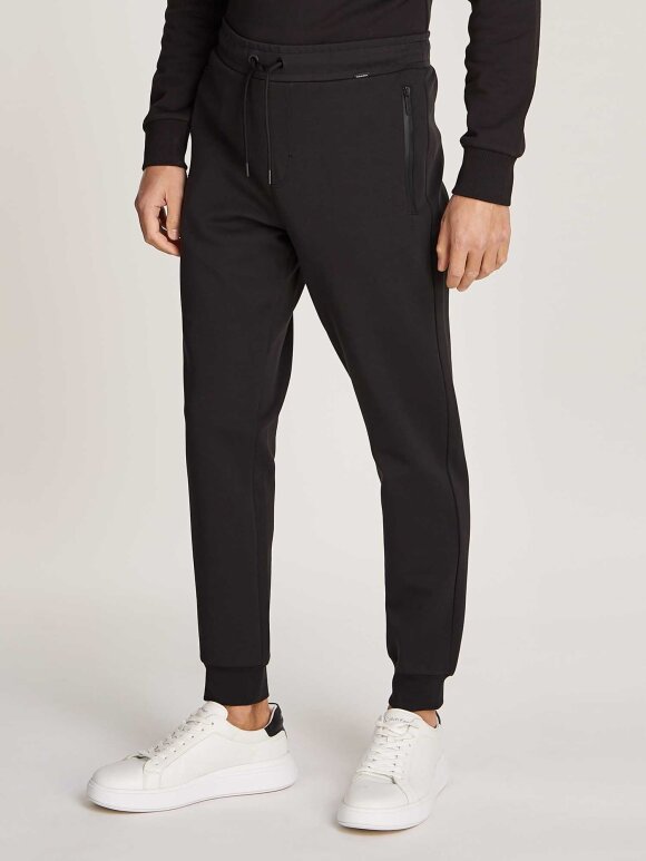 Calvin Klein - CALVIN KLEIN pantalone lux tech SWEAT PANTS